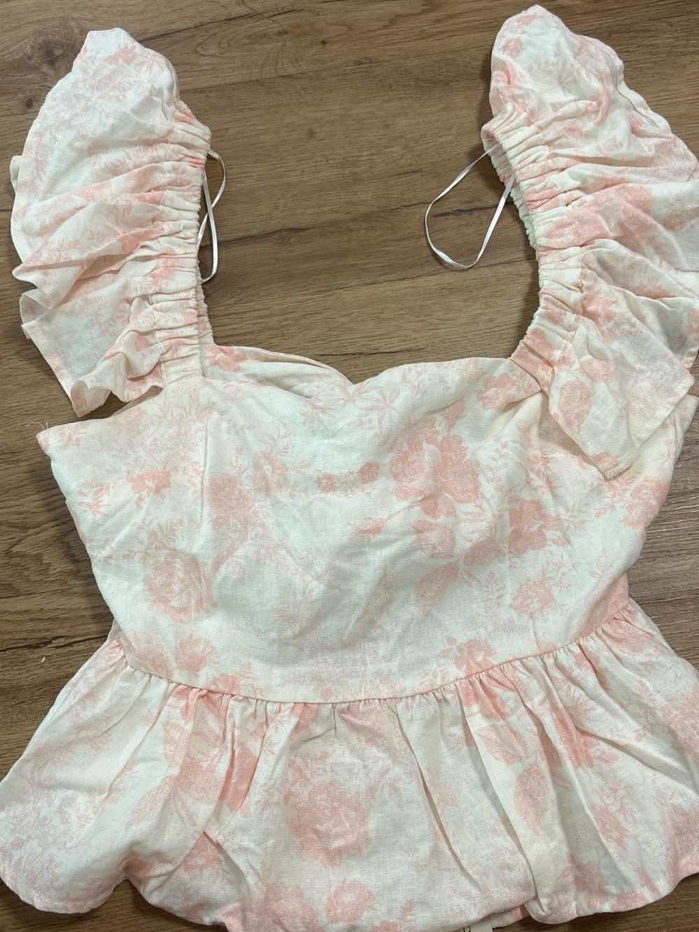Francesca’s pink and white floral babydoll top with ruffle sleeves